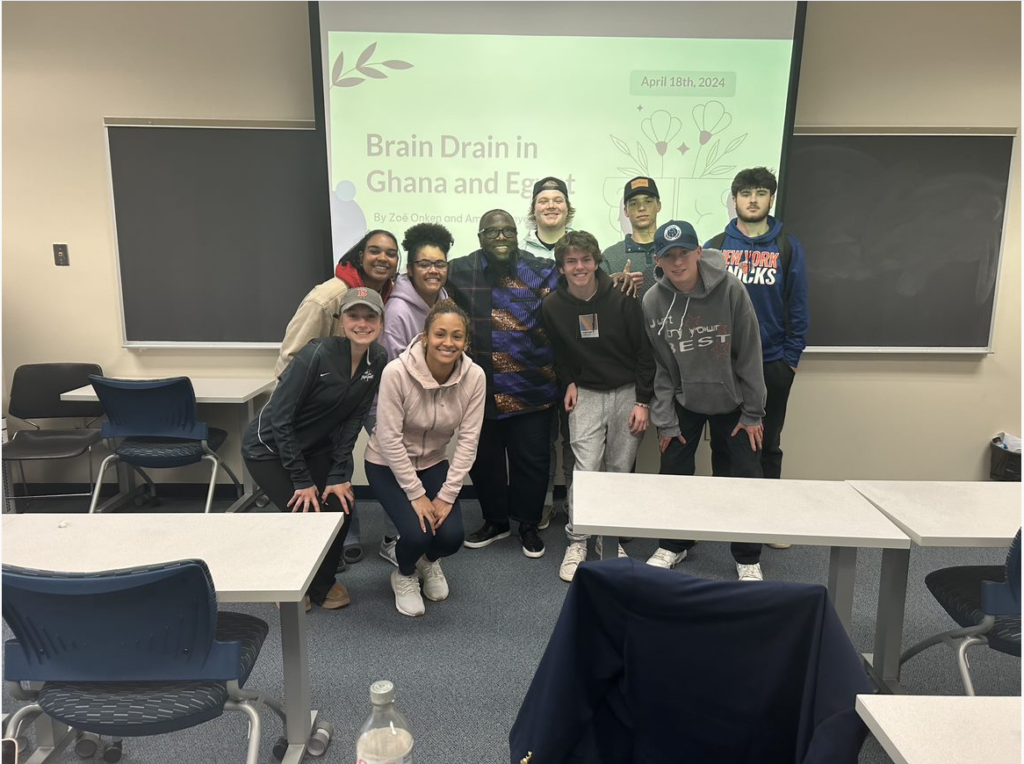 a group of students in front of a screen 